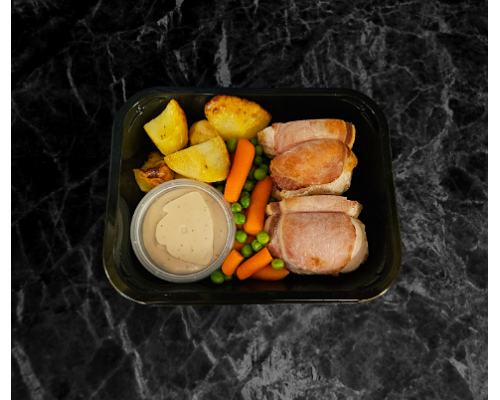 Home made chicken balmoral, peas, roast potatoes, carrots and peppercorn sauce